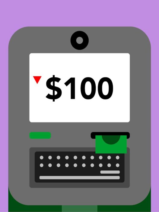 Person using an ATM machine to withdraw cash fee-free