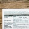 A detailed financial document listing interest rates on a textured wooden table.