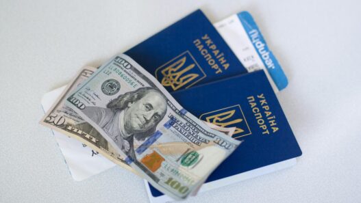 Traveler holding passport and boarding pass at airport
