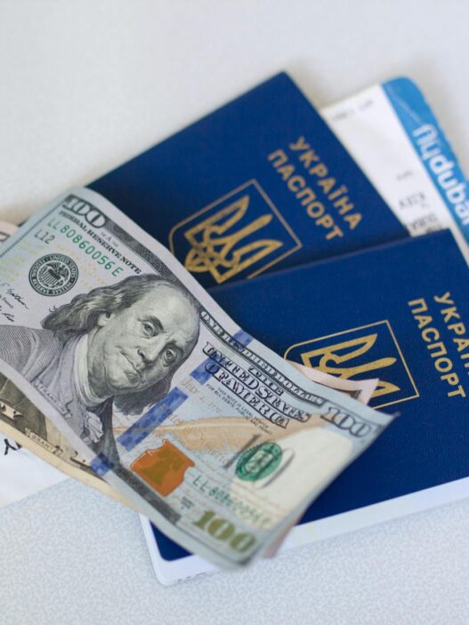 Traveler holding passport and boarding pass at airport