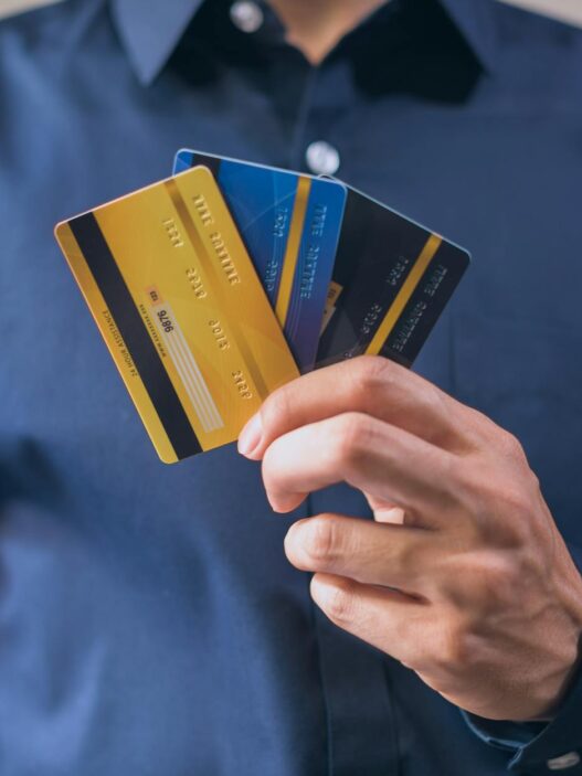 A person using a debit card to make a purchase — high-yield checking