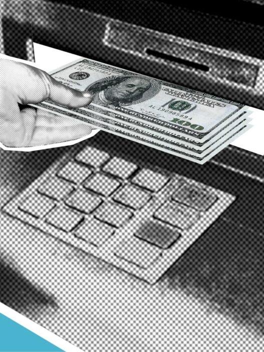 Person using an ATM machine to withdraw cash