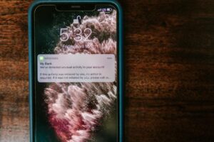 Person using mobile banking app on smartphone