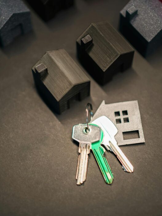 House keys resting on mortgage paperwork, illustrating biweekly mortgage payment strategy