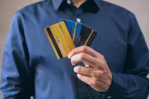 Person reviewing bank statement on a laptop checking for unauthorized charges