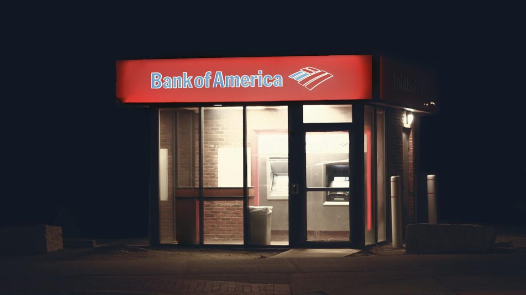 Customer at a bank branch counter using free in-branch banking services