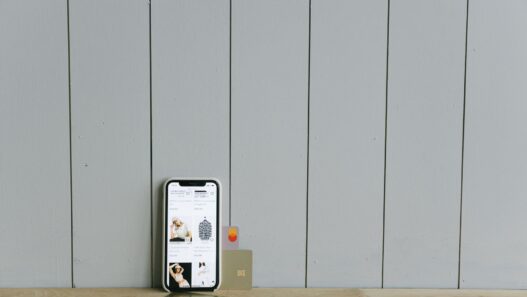 Person using a mobile banking app on a smartphone while shopping