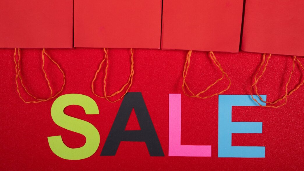 Summer sale and discount tags on store shopping display