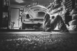Mechanic working on a car in an auto repair shop