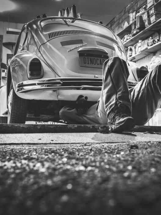Mechanic working on a car in an auto repair shop