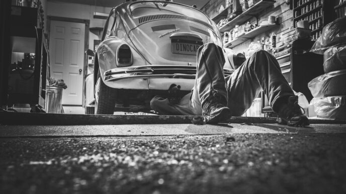 Mechanic working on a car in an auto repair shop
