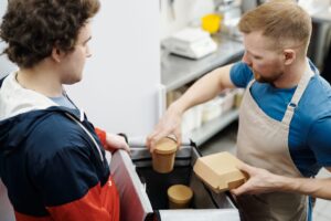 Food delivery takeout order being handed over