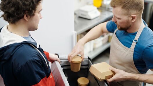 Food delivery takeout order being handed over