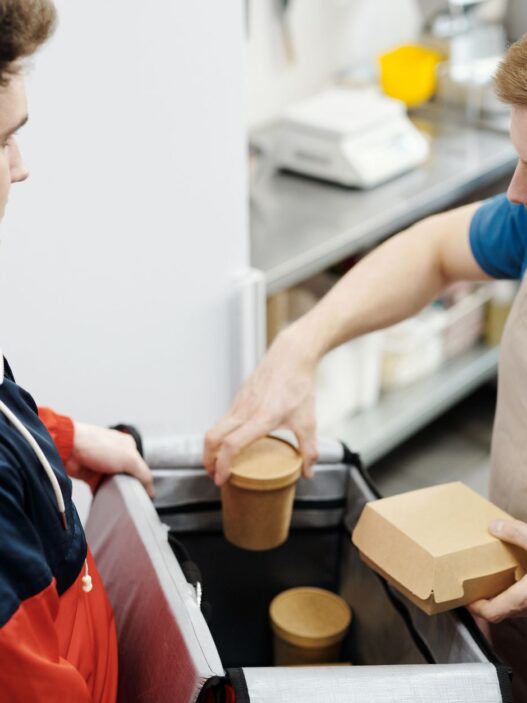 Food delivery takeout order being handed over