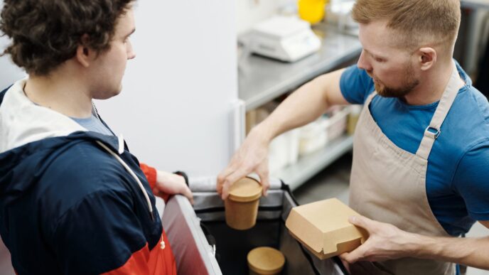 Food delivery takeout order being handed over