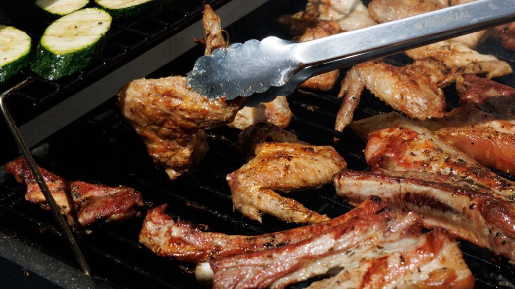 Backyard barbecue grill with food at a summer cookout