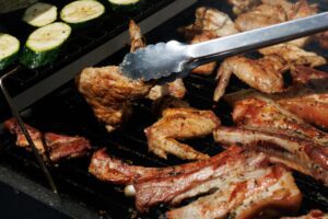 Backyard barbecue grill with food at a summer cookout