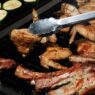 Backyard barbecue grill with food at a summer cookout