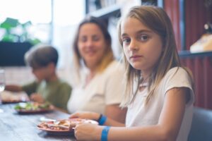 Family with children eating a meal at a restaurant