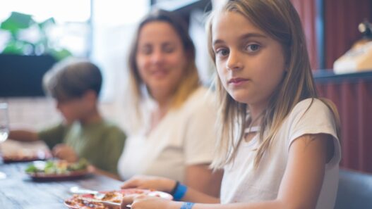 Family with children eating a meal at a restaurant