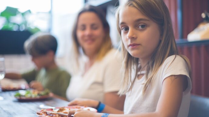 Family with children eating a meal at a restaurant