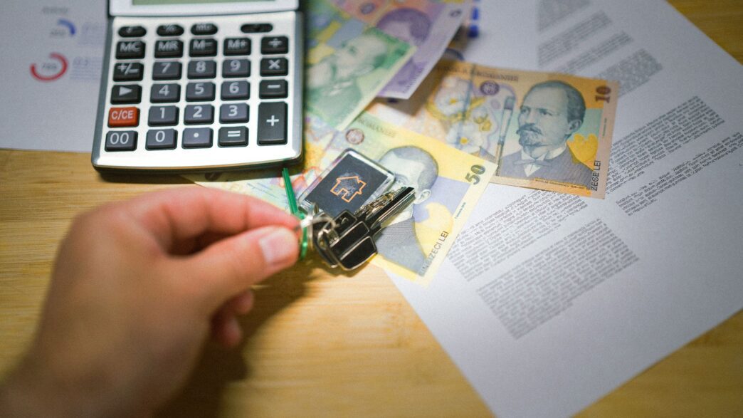 Apartment keys and a lease document on a table, illustrating how to negotiate your rent in 2026.