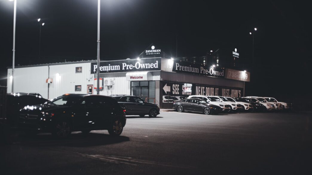 Rows of used cars on a dealership lot in 2026