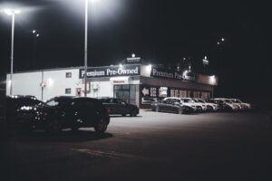 Rows of used cars on a dealership lot in 2026