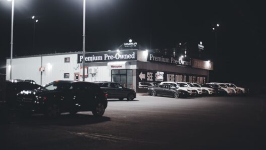 Rows of used cars on a dealership lot in 2026