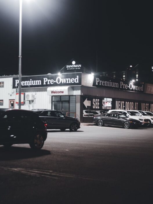 Rows of used cars on a dealership lot in 2026