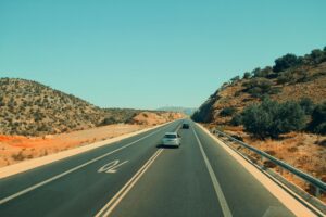 Car on an open highway during a summer road trip