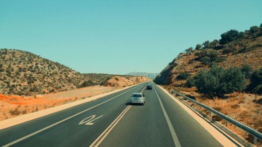 Car on an open highway during a summer road trip