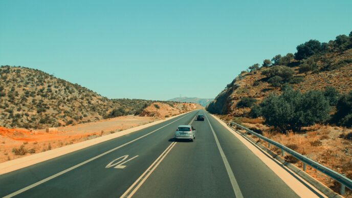 Car on an open highway during a summer road trip