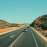 Car on an open highway during a summer road trip
