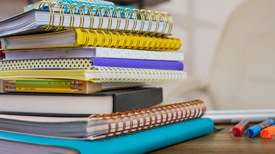 Back-to-school supplies and notebooks representing tax-free weekend shopping savings