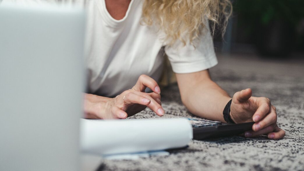 Freelancer reviewing finances and budgeting at a laptop
