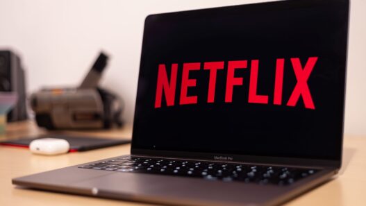 Person reviewing streaming and subscription charges on a laptop to cancel unused subscriptions