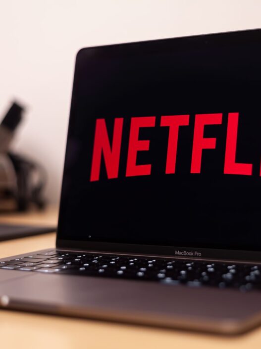 Person reviewing streaming and subscription charges on a laptop to cancel unused subscriptions