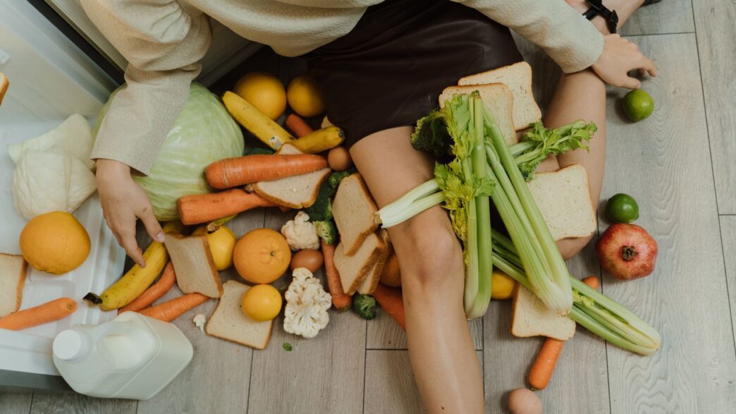 Fresh and leftover produce in a kitchen, illustrating how reducing food waste saves money