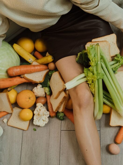 Fresh and leftover produce in a kitchen, illustrating how reducing food waste saves money