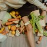 Fresh and leftover produce in a kitchen, illustrating how reducing food waste saves money