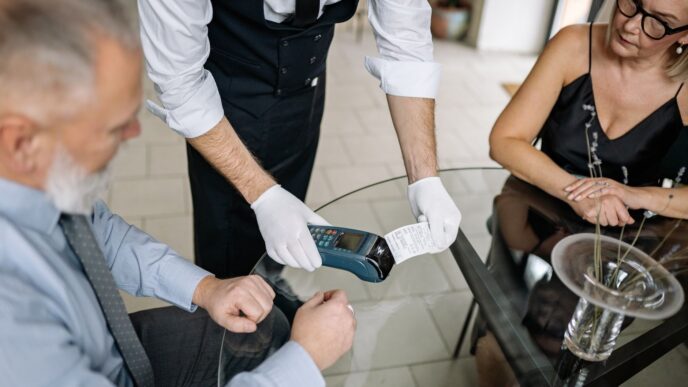 Diners reviewing a restaurant bill at a table