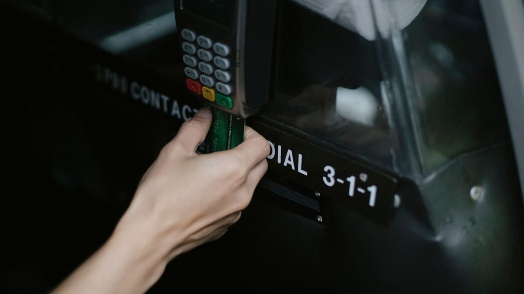 Traveler paying with a credit card on a payment terminal abroad