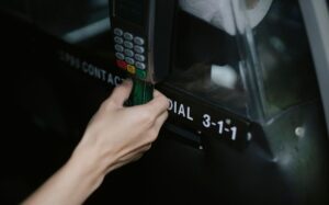Traveler paying with a credit card on a payment terminal abroad