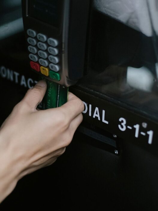 Traveler paying with a credit card on a payment terminal abroad