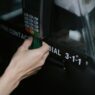 Traveler paying with a credit card on a payment terminal abroad