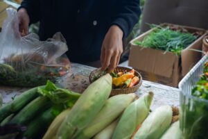 Fresh seasonal produce displayed at a farmers market stall