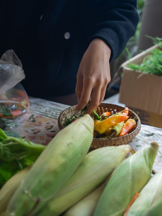 Fresh seasonal produce displayed at a farmers market stall