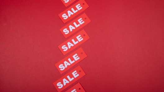 Store sale tags and discount signs representing Labor Day shopping deals