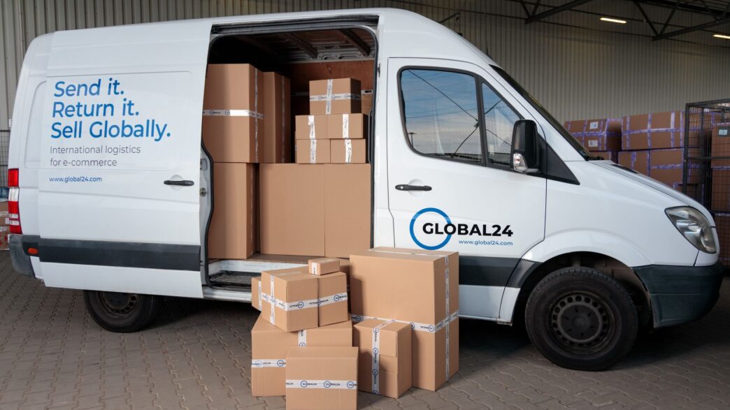 A person packing a cardboard shipping box to return an online order